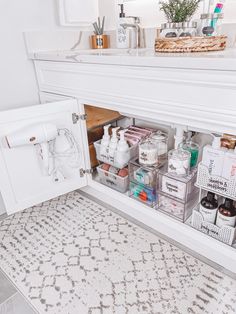 the bathroom is organized and ready to be used as a storage area for personal care items