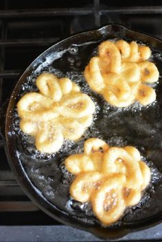 some fried food is cooking in a frying pan on the stove top burner