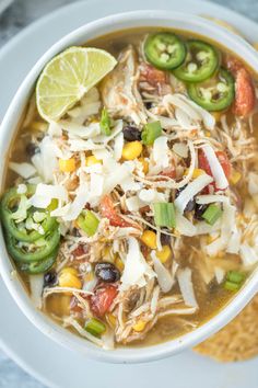 a white bowl filled with chicken tortilla soup