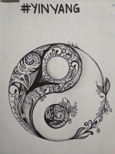 the yin symbol is drawn in black and white with an intricate design on it's side