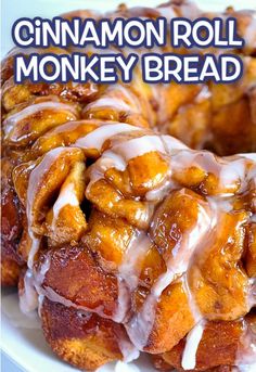 cinnamon roll monkey bread on a white plate with the words cinnamon roll monkey bread above it