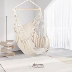 This hammock chair swing brings breezy style to your porch, patio, or favorite tree. It’s suspended by a material hanging loop and ropes and features a wooden spreader bar and a full cotton canvas seat. The removable seat and back cushions are included for added comfort and support. This chair is easy to hang. It completes the look in any coastal, bohemian, or cottage setting. Sand & Stable™ Color: White | Sand & Stable™ Tabitha Portable Chair Hammock 49.6 H x 31.56 W x 35.43 D in brownCotton in Hammock Chair Cheap, Indoor Hammock Chair With Stand, Teen Room Hammock, Room Hammock, White Hammock, Hammock Ssmall Adult Chair Living Room, Hanging Rope Chair, Rope Chair, Hammock Accessories