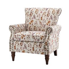 an upholstered chair with floral print on the back and arms, sitting against a white background