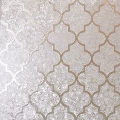 a white and silver wallpaper with an intricate design