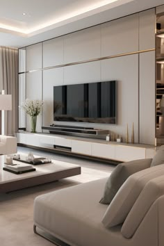 modern living room with white furniture and large screen tv