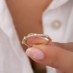 a close up of a person holding a ring