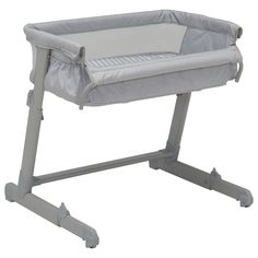 a grey baby crib with wheels on the bottom and one foot in the middle