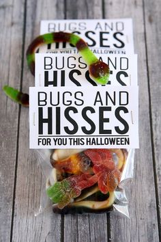 there is a bag of bugs and kisses for you this halloween on the wooden table