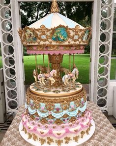 an elaborately decorated carousel sits on a table