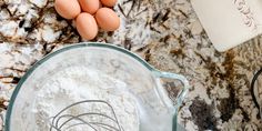 eggs and flour in a blender on a marble counter