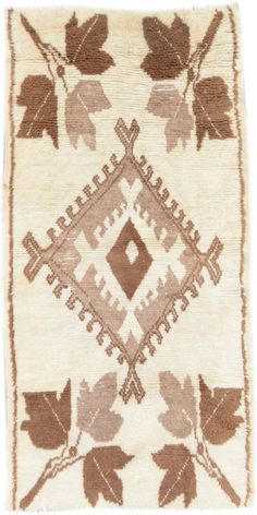 an old rug with leaves on it