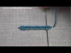 someone is crocheting the stitchs together to make a piece of yarn that looks like an arrow