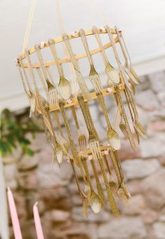 a chandelier with forks and spoons hanging from it