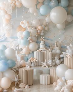 a room filled with lots of balloons and seashells