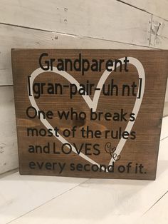 a wooden sign that says grandparents granpair - uhn one who breaks most of the rules and loves every second