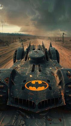 the batmobile is parked on the side of the road in the middle of nowhere