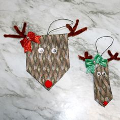 two christmas decorations made to look like reindeers