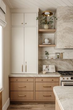 the kitchen is clean and ready for us to use it's marble counter tops