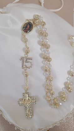 Looking for something extraordinary for that upcoming special occasion? This is a beautiful and elegant rosary made with high quality crystals. This gorgeous rosary is perfect for any occasion. It is absolutely unique and gorgeous from every angle. This gorgeous rosary features a beautiful elegant design. This is perfect for a First Communion, Confirmation, Christening, Quinceanera, or wedding for that special day! All items are custom made to order. Our turn around time is about 5-10 business d Necklaces For Quinceaneras, Quince Bible And Rosary, Themes For Quinceanera Decoration, Pink Quince Accessories, Unique Quinceanera Themes, 15 Ideas Quinceanera, Gold Quinceanera Decorations, 15 Quinceanera Ideas, Quince Venue Ideas