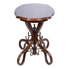 a wooden table with an intricate design on it's top and bottom, against a white background