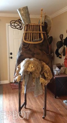 an oven made to look like a lion is on display in a living room with wood floors