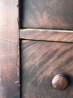 an old wooden drawer with some knobs on it