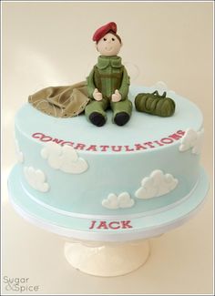 there is a cake with a toy soldier on it and the words congratulations jack written in red