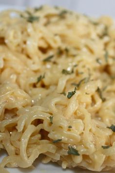 a plate with noodles and parmesan cheese on it