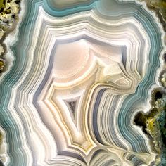 an aerial view of the inside of a agate geoglye stone structure with white, blue and grey colors