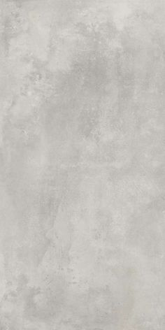 a gray concrete wall textured with light grey paint