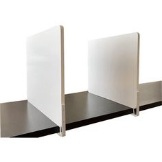 two black and white bookshelves with metal brackets