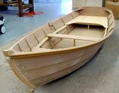 a wooden boat being built in a workshop