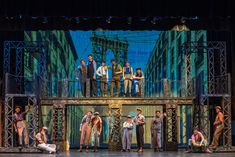 a group of people standing on top of a stage