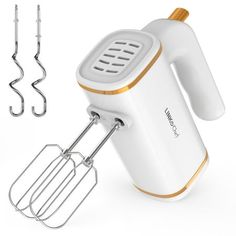 an electric hand mixer with three attachments