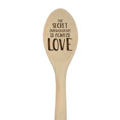 a wooden spoon with an inscription on it that says, the secret ingredient is always love