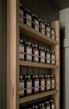 the shelves are filled with different types of spices