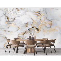 a dining room table with chairs and a large marble wall in the backround