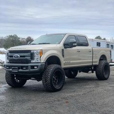 a large white truck parked in a parking lot