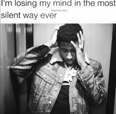 a man holding his head while standing in front of a mirror with the caption, i'm losing my mind in the most silent way ever