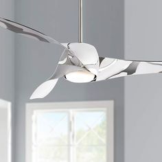 a white ceiling fan in a room