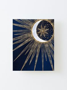 the moon and stars are in front of a blue background with gold foil on it