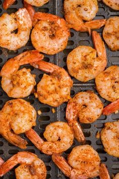 grilled shrimp is being cooked on the grill