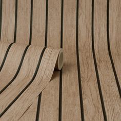 a close up of a wooden surface with black lines on the wood grained material