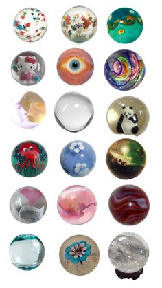 an assortment of glass knobs with animals and flowers painted on them in different colors