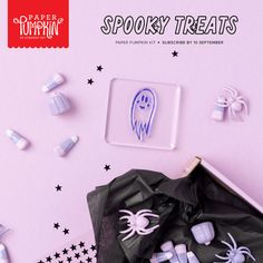 spooky treats are in a box on a pink background with black and white stars