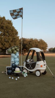 a golf cart with balls and a flag on it