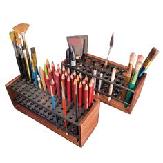 a wooden box filled with lots of different colored pencils