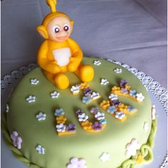 there is a cake that looks like a monkey sitting on top of the letters i love you