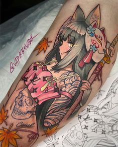 a woman with tattoos on her leg holding a unicorn skull and wearing a pink shirt