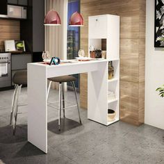 a white desk with two stools next to it in a room filled with furniture